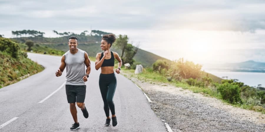 8 Fun and Sober Social Activities to Try After AA Meetings Two people running after attending an AA meeting