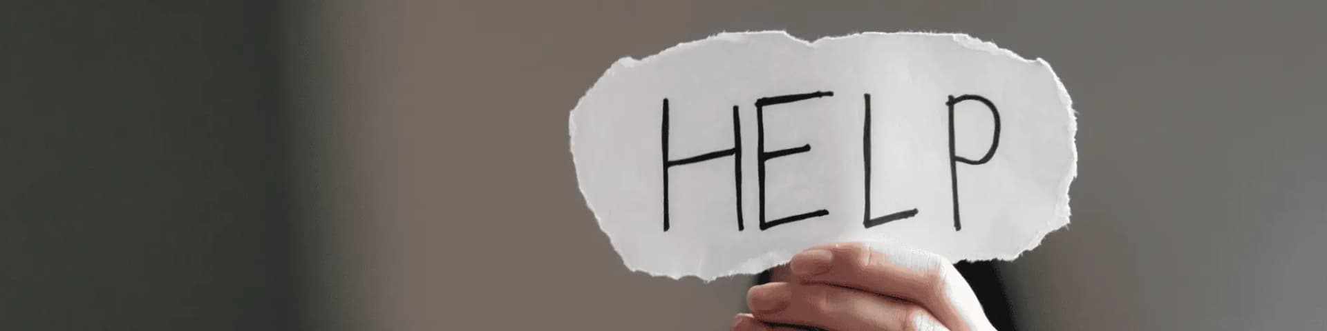 Alcoholism and Mental Health Disorders: Call AA Hotline for Help Someone holding out a "help" sign