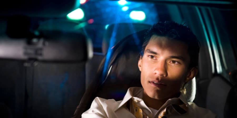 Avoiding drunk driving A guy stays safe by not drunk driving on his way home from a party