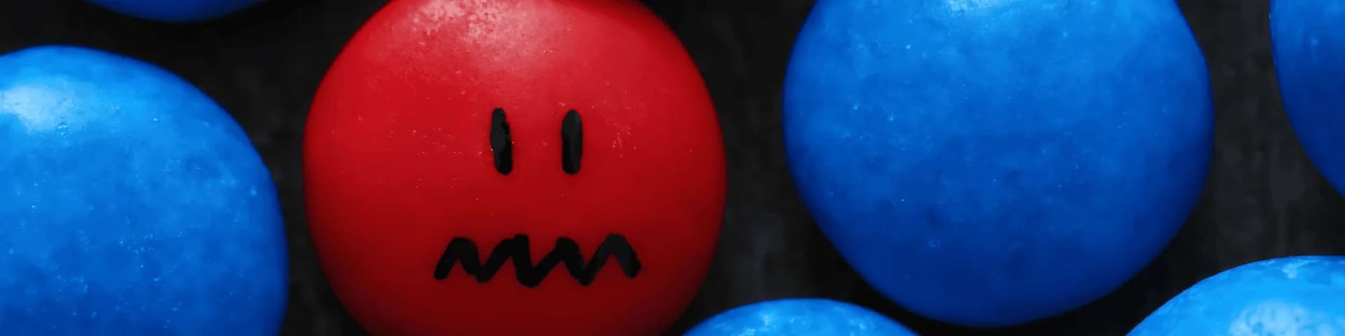 Breaking Isolation: The Social Side of Sobriety A red stone among blue stones, showing isolation