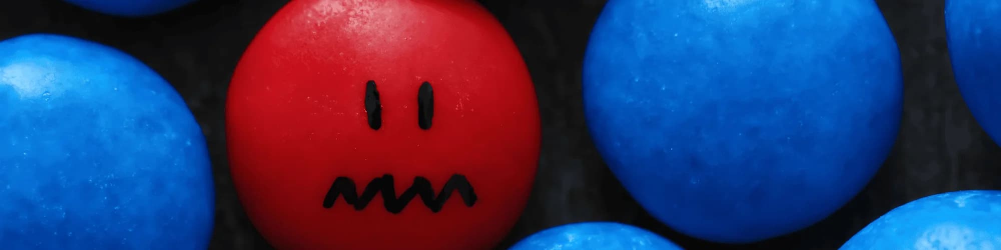 Breaking Isolation: The Social Side of Sobriety A red stone among blue stones, showing isolation