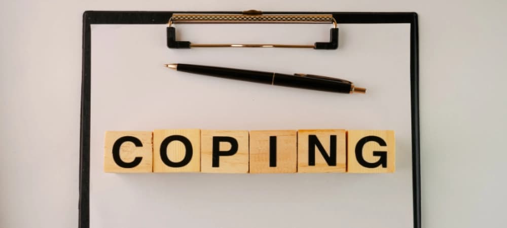 Coping Mechanisms for Staying Sober A photo of a board with the word "coping" on it, reminding us of the different coping mechanisms AA meetings near me has taught us