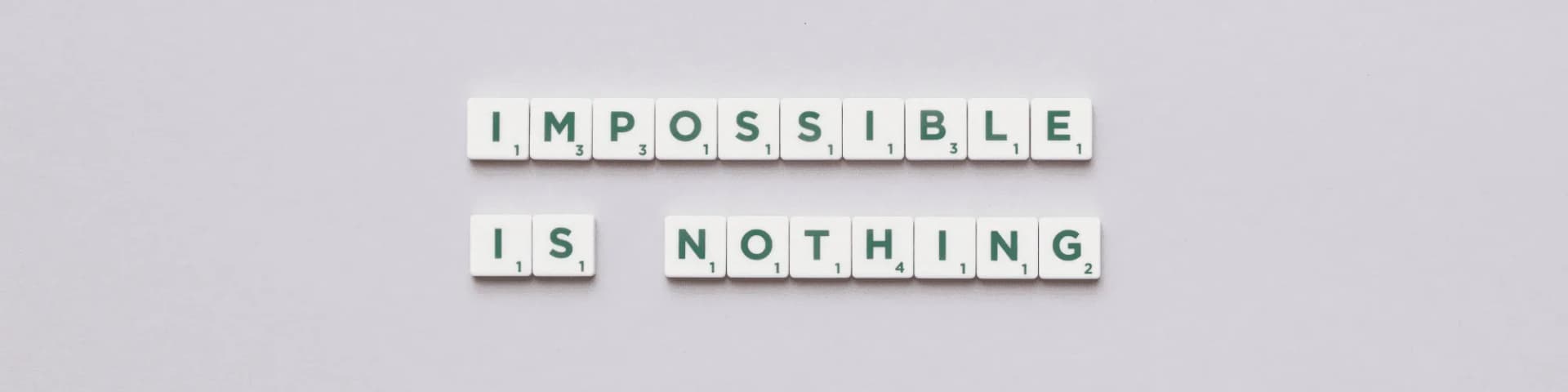 How Smithtown Serenity AA Nearby Aids in Overcoming Alcohol Abuse tiles that say "impossible is nothing"