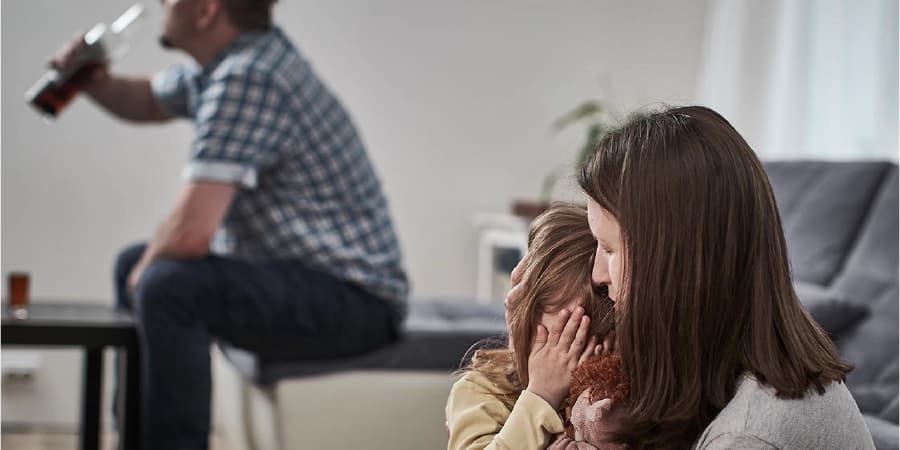 How an alcoholic affects their family A father drinking in front of his family