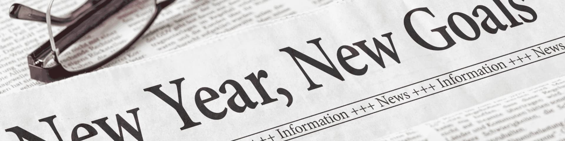 Set Realistic Sobriety Goals for 2025 with AA Meetings Near You A newspaper with a print that says "new year, new goals"