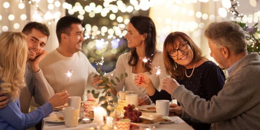 Sober Holiday Celebration with Friends Friends celebrating the holidays without alcohol.