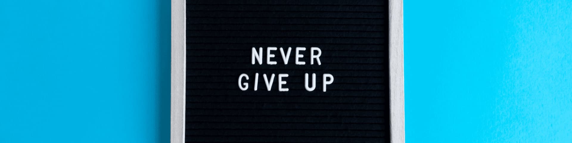 Stay Motivated in Recovery: Find NY Intergroup AA Meetings A sign that says "never give up"