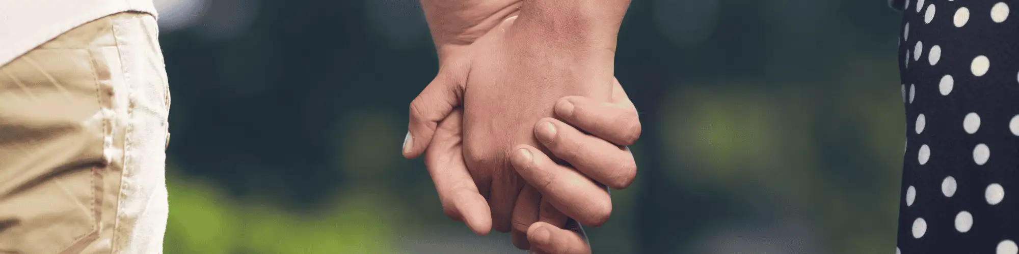 Strengthen Relationships in Sobriety: Attend AA Meetings Houston hands holding one another, representing a strong relationship