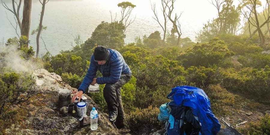 The Importance of Staying Sober for a Safe Hiking Adventure in Virginia A hiker preparing his food