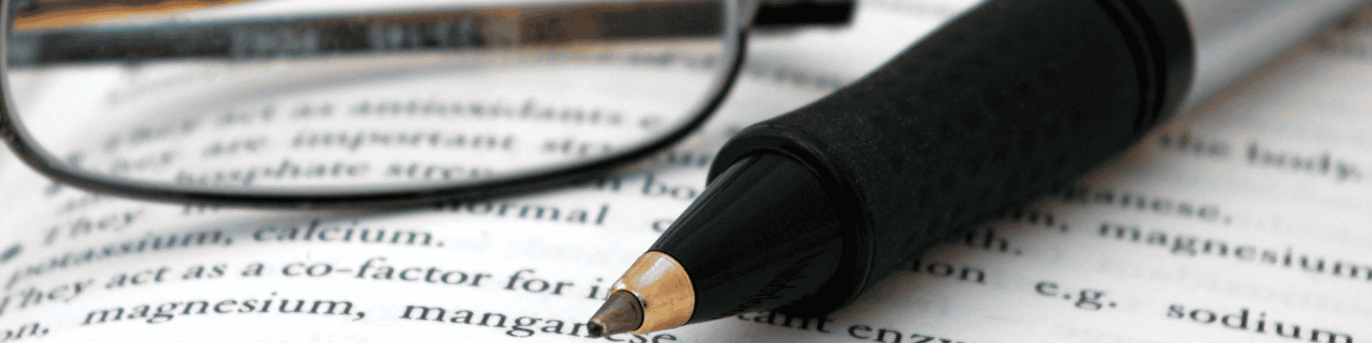 researching manually pen ,book and reading glasses for researching